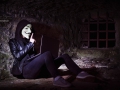 An indifinited person with Anonymous mask and notebook