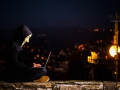 An indifinited person with Anonymous mask and notebook